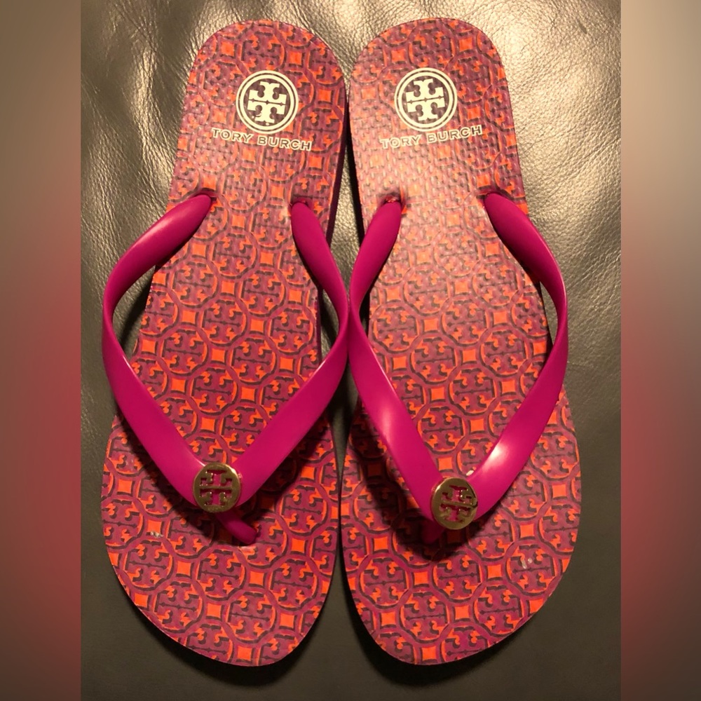 Tory Burch logo print flips in fuchsia/orange. No size shown-total length is 11”